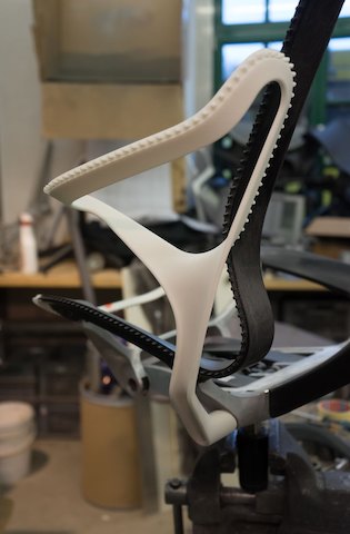 A close-up of a prototype of the leaf arm on a Cosm Chair.