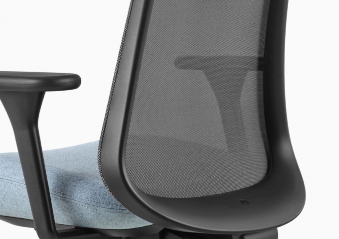 Close up image of a black and light blue Lino Chair, viewed from the back at an angle.