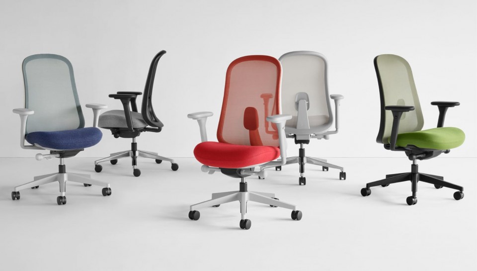 Five Lino Chairs in blue, black, grey, red and green viewed from various angles.