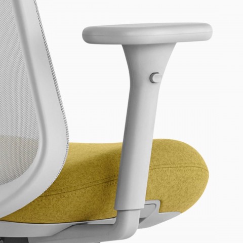Close up image of a grey and yellow Lino Chair with adjustable sacral lumbar support and adjustable height arms, viewed from the back at an angle.