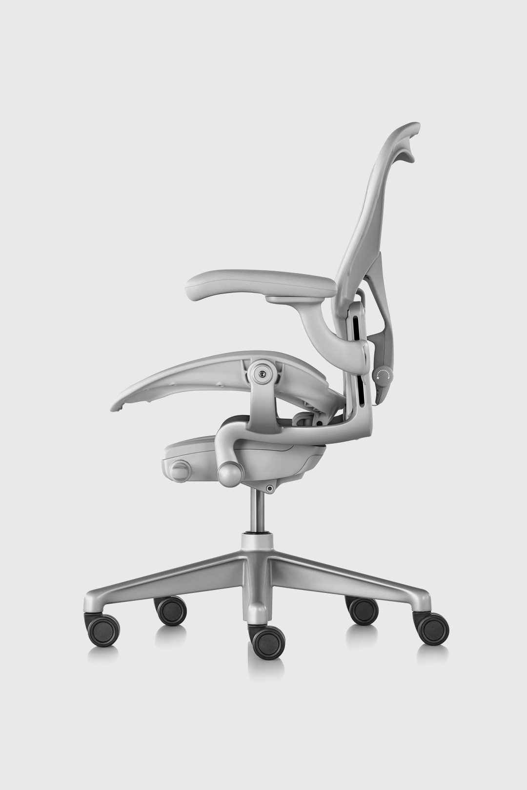 Complete side view of the new Aeron Chair in Mineral finish in front of a white background